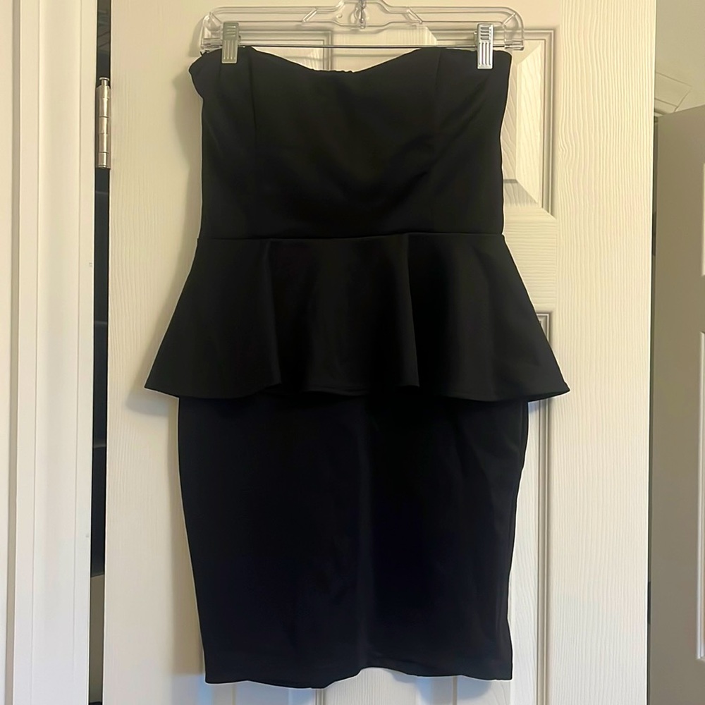 Arden B. Black mini dress with peplum at the waist & stylish cut out in the back
